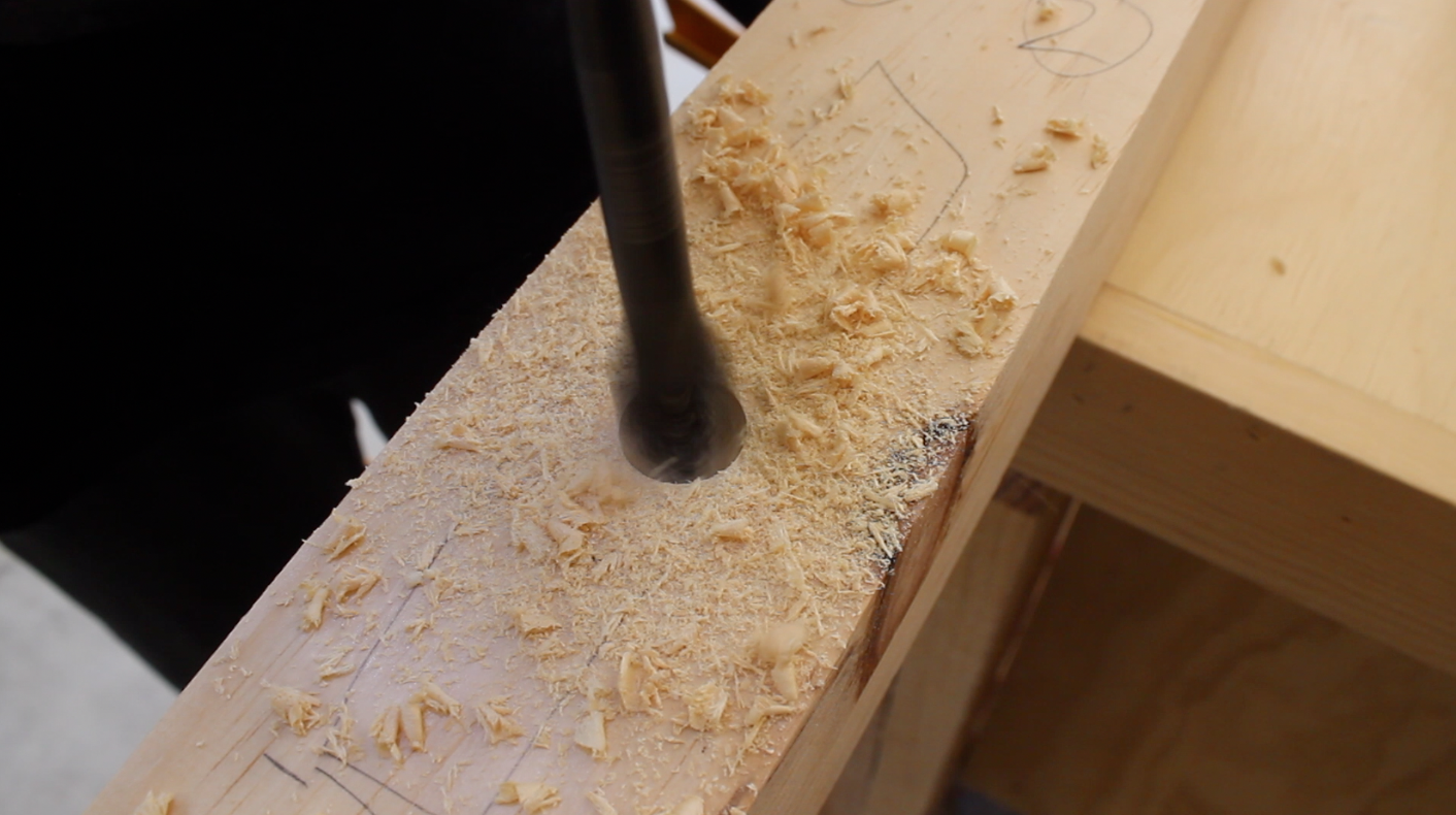 Drilling a hole for the through mortise with a spade bit